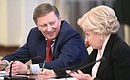 Before the meeting with Government members. Chief of Staff of the Presidential Executive Office Sergei Ivanov and Deputy Prime Minister Olga Golodets.