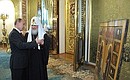 Following the meeting with representatives of autocephalous Orthodox Churches, Vladimir Putin presented Patriarch Kirill of Moscow and All Russia with Life of Solovetsky Saints icon.