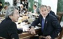 U.S. President George W. Bush and Japanese Prime Minister Junichiro Koizumi during a G8 summit work session.