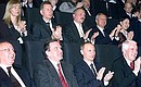 President Putin and German Chancellor Gerhard Schroeder at a concert of Russian and German musicians.