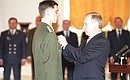 Ceremony of presenting state awards to Russian military personnel. Senior Lieutenant Grigory Galkin receiving Hero of Russia Star.