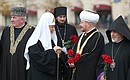 From left: Chairman of the North Caucasus Muslim Coordination Centre Ismail Berdiev, Patriarch Kirill of Moscow and All Russia, Chairman of the Spiritual Administration of Muslims of Russia Ravil Gaynutdin and Head of the Russian and Novo-Nakhichevan Diocese of the Armenian Apostolic Church Archbishop Ezras during the flower-laying ceremony at the monument to Kuzma Minin and Dmitry Pozharsky.