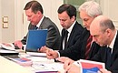 At a meeting on economic issues. From left to right: Chief of Staff of the Presidential Executive Office Sergei Ivanov, Deputy Prime Minister Arkady Dvorkovich, Economic Development Minister Andrei Belousov, and Finance Minister Anton Siluanov.
