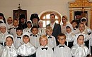 Children’s choir of Reverend Ilya of Murom Orthodox School performed for Dmitry Medvedev and Svetlana Medvedeva Agnaparfene (Holy Lady) by Nektary Eginsky in Greek.