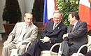 President Putin with Canada\'s Prime Minister Jean Chr?tien and German Chancellor Gerhard Schroeder (right) during the presentation ceremony for the Global Fund to Fight AIDS, Tuberculosis and Malaria.