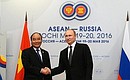 With Prime Minister of Vietnam Nguyen Xuan Phuc. Photo: russia-asean20.ru
