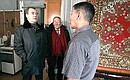 Viewing a flat in a dilapidated building. Head of the Republic of Sakha (Yakutia) Yegor Borisov (centre).