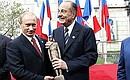 With French President Jacques Chirac at the opening ceremony of a monument to General De Gaulle. French President was presented the small copy of the monument.