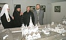 President Putin visiting the Solovetsky Saviour-Transfiguration Monastery to view the monastery\'s museum with Patriarch of Moscow and All Russia Alexii II (left) and Governor of the Arkhangelsk Region Anatoly Yefremov (right).
