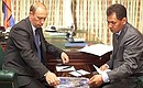President Putin with Sergei Shoigu, Minister for Civil Defense, Emergency Situations and Natural Disaster Response.