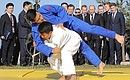 Vladimir Putin and President of the Republic of Korea Moon Jae-in watch a demonstration performance by a youth judo team from the Sakhalin Region. Photo: TASS