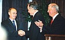President Vladimir Putin meeting with George Bush Sr. at Rice University.