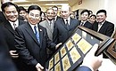 The opening of Russia-Vietnam Joint Venture Bank. The Russian partners gave Vietnamese President Nguyen Minh Triet (left of Vladimir Putin, foreground) a mosaic consisting of all Russian banknotes in circulation.