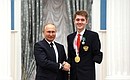 Presenting state decorations to winners of the 2020 Summer Paralympic Games in Tokyo. Daniil Smirnov, swimming champion of the Paralympics, receives the Order of Friendship. Photo: RIA Novosti