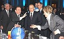 President Putin with German Federal Chancellor Gerhard Schroeder and Valentina Matvienko, presidential envoy to the Northwestern Federal District, at a gala for the 150th anniversary of the Siemens\' work in Russia.