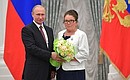 At a presentation of state decorations. Dairy worker of the Krasnoselskoye farm (Novosibirsk Region) Gulnisa Dyusenova has received the honorary title of Honoured Agricultural Worker of the Russian Federation.