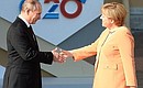 Перед началом рабочего заседания глав государств и правительств стран «Группы двадцати». С Федеральным канцлером Германии Ангелой Меркель. Фотохост-агентство G20 Russia