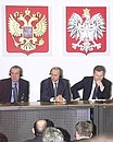 President Putin with Polish President Alexander Kwasniewski and President of the Russian Union of Industrialists and Entrepreneurs Arkady Volsky (left) during the Second Poland-Russia Economic Forum.