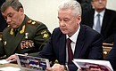 Chief of General Staff of the Armed Forces and First Deputy Defence Minister Valery Gerasimov (left) and Moscow Mayor Sergei Sobyanin before a Security Council meeting.
