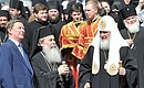 Chief of Staff of the Presidential Executive Office Sergei Ivanov, Patriarch Theophilos III of Jerusalem, and Patriarch Kirill of Moscow and all Russia at the unveiling of the monument to Patriarch Hermogenes of Moscow and all Russia.