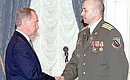 Alexei Makhotin, an internal service colonel who fought in Chechnya, being given the title of Hero of Russia at a state award ceremony.