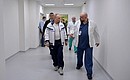 During a visit to a hospital in the town of Kommunarka near Moscow intended for patients with suspected coronavirus infection. With Head Physician of City Clinical Hospital No. 40 Denis Protsenko.