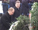 President Putin with Polish President Alexander Kwasniewski during a wreath-laying ceremony at the Obelisk to Soviet Soldiers.