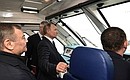 Перед открытием железнодорожного движения по Крымскому мосту Владимир Путин проехал в кабине машиниста и осмотрел весь участок железной дороги.