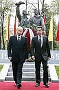 With French President Nicholas Sarkozy at the unveiling of a monument to the Normandy–Nieman Regiment.
