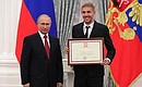 A letter of recognition for contribution to the development of Russia football and high athletic achievement is presented to Russia national football team player Yury Gazinsky.