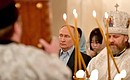 Vladimir Putin attends a Christmas service at the Church of the Icon of Saviour Not Made by Hands in Novo-Ogaryovo. Photo: Mikhail Voskresensky, RIA Novosti