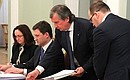 Before the meeting on developing the electricity grid system. From left to right: Presidential Aide Elvira Nabiullina, Energy Minister Alexander Novak, Rosneft CEO Igor Sechin, and Presidential Advisor Anton Ustinov.