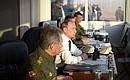 At the Donguzsky Test Ground during the final stage of the Tsentr-2015 strategic headquarters military exercises. With Defence Minister Sergei Shoigu (left).