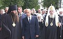 President Putin with Patriarch Alexii II of Moscow and All Russia in one of the central town squares.
