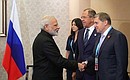 Aide to the President Yury Ushakov, Foreign Minister of Russia Sergei Lavrov, Indian Prime Minister Narendra Modi (right to left).