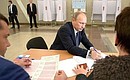Vladimir Putin votes in the Moscow mayoral election at polling station No. 2151 in southwest Moscow.