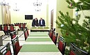 After Christmas mass, Vladimir Putin tours the building of the religious educational centre at the Church of the Intercession of the Holy Virgin in the village of Turginovo in Tver Region.