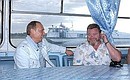 President Putin with actor Mikhail Yevdokimov during a boat trip down the Katun River.