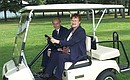 President Putin and President Tarja Halonen driving in an electric car.