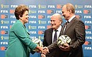 С Президентом Бразилии Дилмой Роуссефф и президентом Международной федерации футбольных ассоциаций (ФИФА) Йозефом Блаттером во время церемонии передачи права проведения чемпионата мира по футболу от Бразилии России.