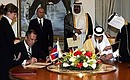 At the ceremony of signing Russian-Qatari documents.