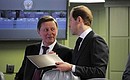 Chief of Staff of the Presidential Executive Office Sergei Ivanov with Industry and Trade Minister Denis Manturov before the beginning of the unified military goods commissioning day.
