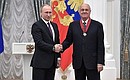 At a ceremony presenting state decorations. Vladimir Menshov, film director at Mosfilm Cinema Concern, was awarded the Order for Services to the Fatherland II degree.