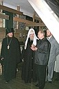 President Putin visiting the Solovetsky Saviour-Transfiguration Monastery with Patriarch of Moscow and All Russia Alexii II (centre) to inspect exhibits at a museum in the Saviour-Transfiguration Cathedral.