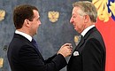 Presenting Russian state decorations to foreign citizens. Gazprom Board of Directors member Burckhard Bergmann (Germany) receives the Order of Friendship.