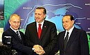 With Turkish Prime Minister Recep Tayyip Erdogan and Italian Prime Minister Silvio Berlusconi.