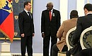 Dmitry Medvedev presented the Order of Friendship to President of the International Association of Athletics Federations (IAAF) Lamine Diack.