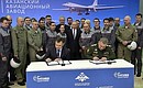 The signing of a contract between the Defence Ministry and Tupolev PJSC on the delivery of the upgraded Tu-160M supersonic strategic missile carriers to the Defence Ministry. Vladimir Putin attended the signing of the contract by Deputy Defence Minister Yury Borisov and United Aircraft Corporation (UAC) President Yury Slyusar.