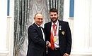 Presenting state decorations to winners of the 2020 Summer Paralympic Games in Tokyo. Kirill Smirnov, archery champion of the Paralympics, receives the Order of Friendship. Photo: RIA Novosti