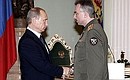 Ceremony awarding state decorations to participants in the Chernobyl nuclear power plant cleanup operation. Colonel Sergei Zykov receives the Order of Courage.